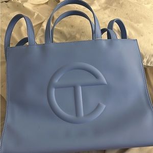 Medium, cerulean blue Teflar bag. I don’t wear it so I’m selling it